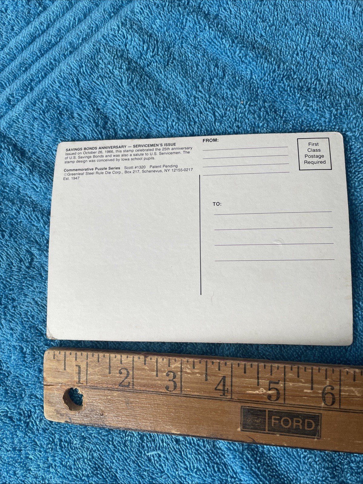 Vintage novelty puzzle resembling a US Savings Bond postage stamp.