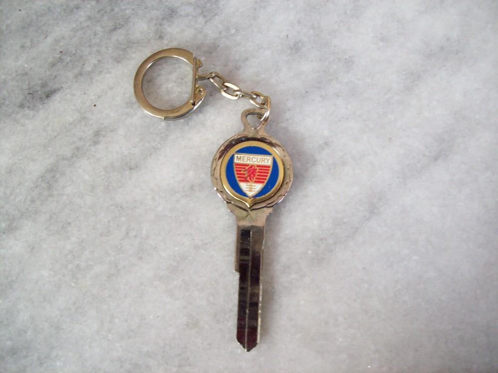 VINTAGE  MERCURY  KEY CREST  KEY CHAIN ...D ON BACK