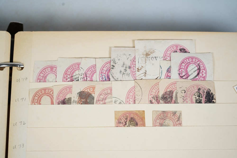 US COLLECTION OF 1,200+ STATIONERY CUT SQUARE STAMPS STORED IN STOCKBOOK