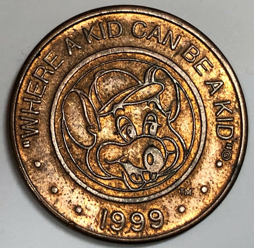 # C3696      CHUCKY  CHEEZE  BRONZE  TOKEN    1999