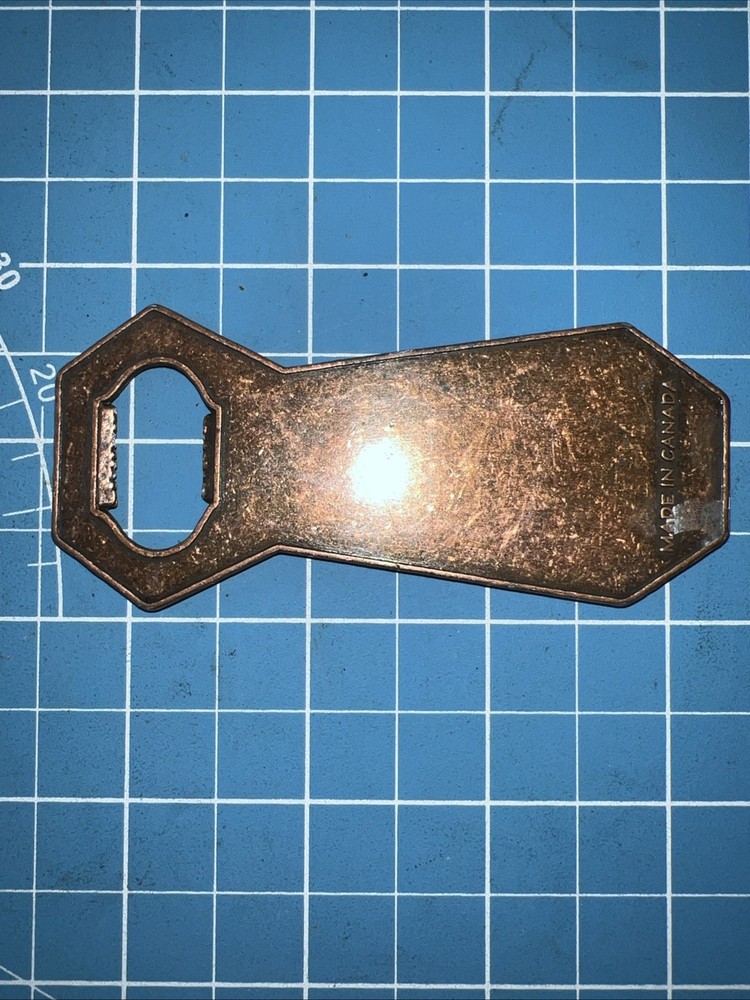 A Devil Mountain Brewing Co Copper Bottle Opener Made In Canada