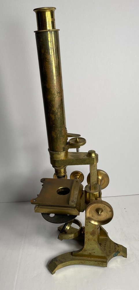 Antique Signed J.H. Steward microscope with case and some accessories.