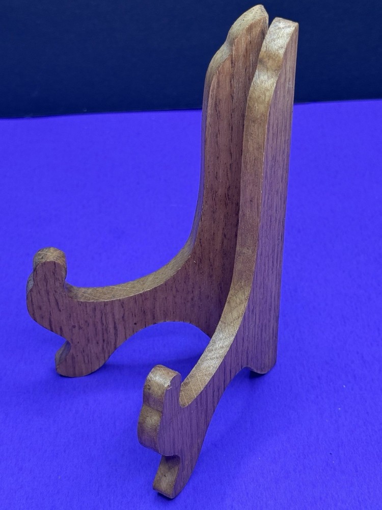 Brown wooden stand for decorative plate