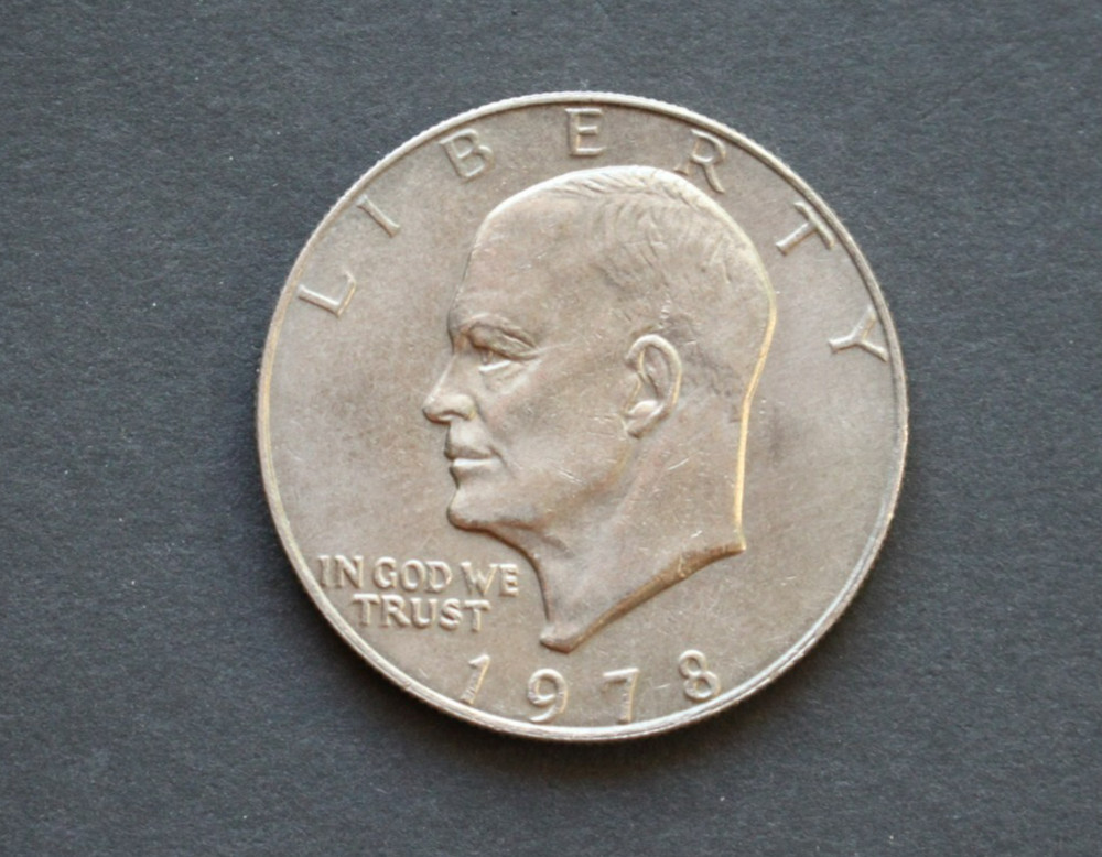 1978 Eisenhower dollar/about uncirculated/tripled rim error; rare