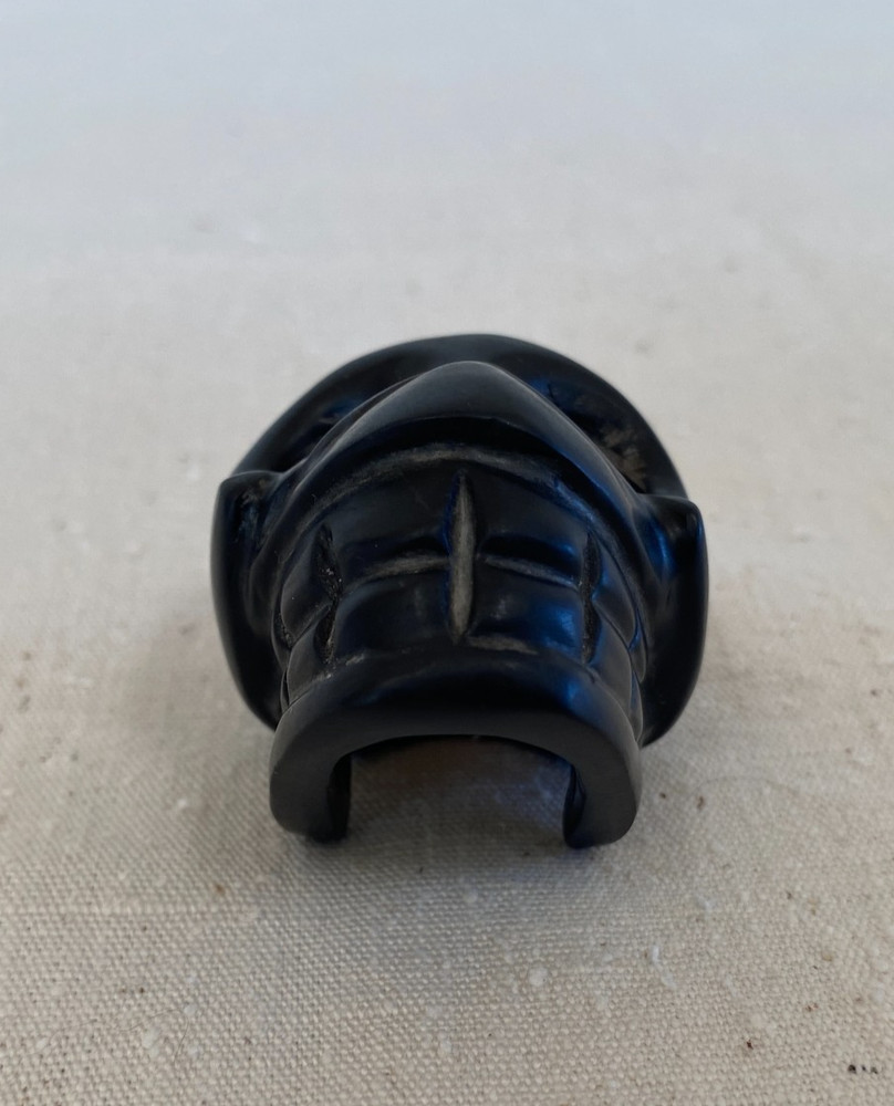 Stylized Carved Stone Skull Pendant