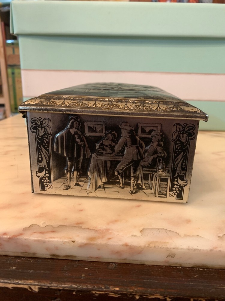 VINTAGE RUBENS EMBOSSED TIN BOX KEYLESS BOX