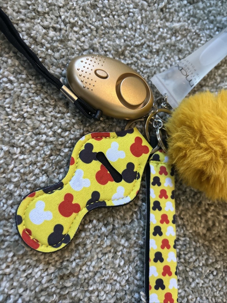 personal safety keychain set with several attached accessories.