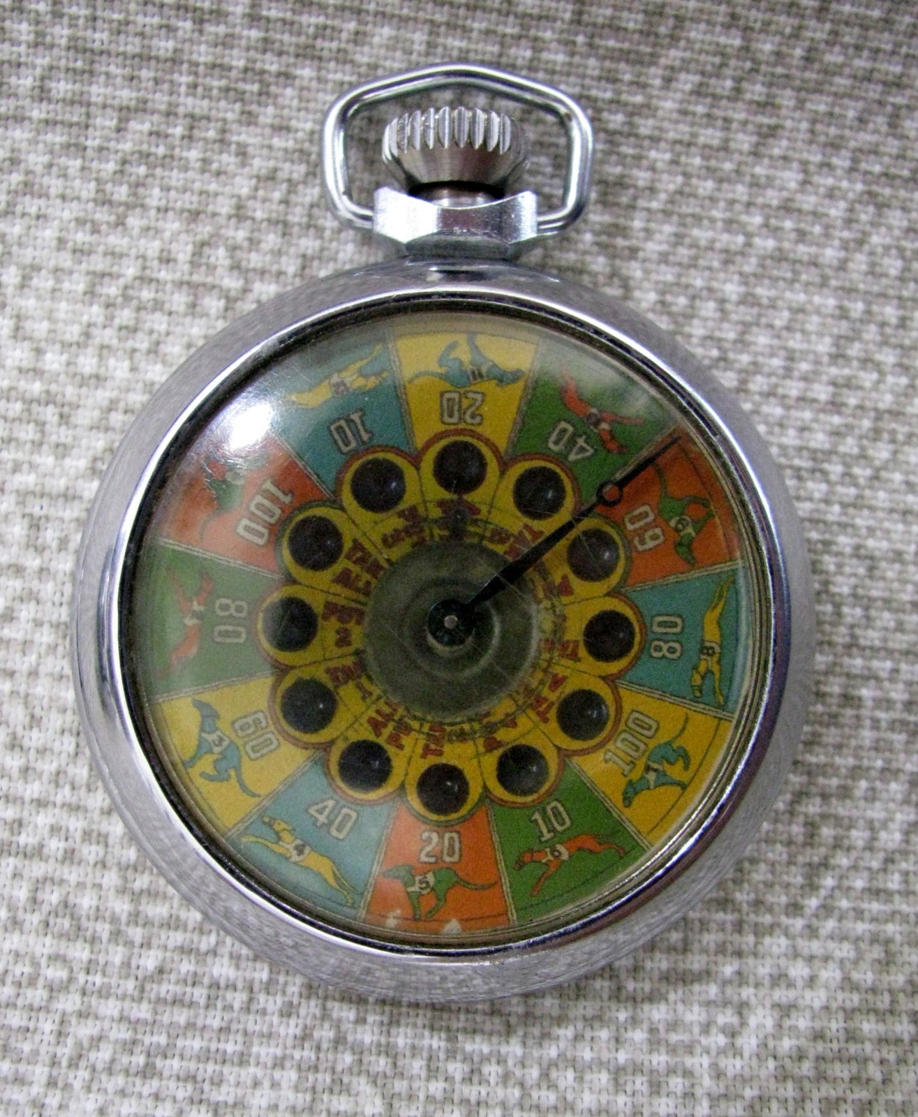 SCARCE PATTERN MECHANICAL GAMBLING DEVICE VINTAGE POCKET SIZE 12 DOGS / PUT+TAKE