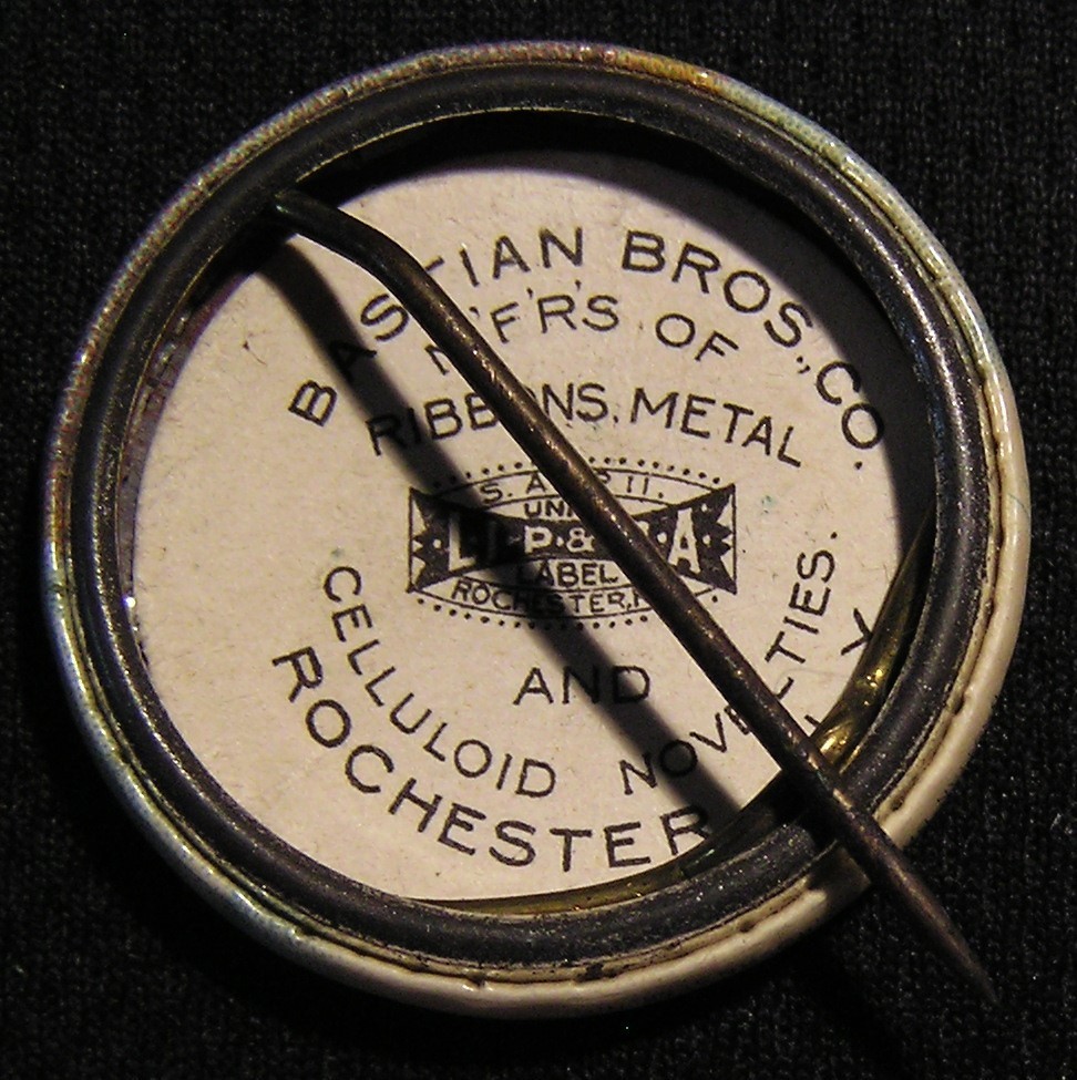 RARE ANTIQUE SANTA CLAUS "MEET ME AT THE BON TON" FLYING MACHINE AIRSHIP PIN