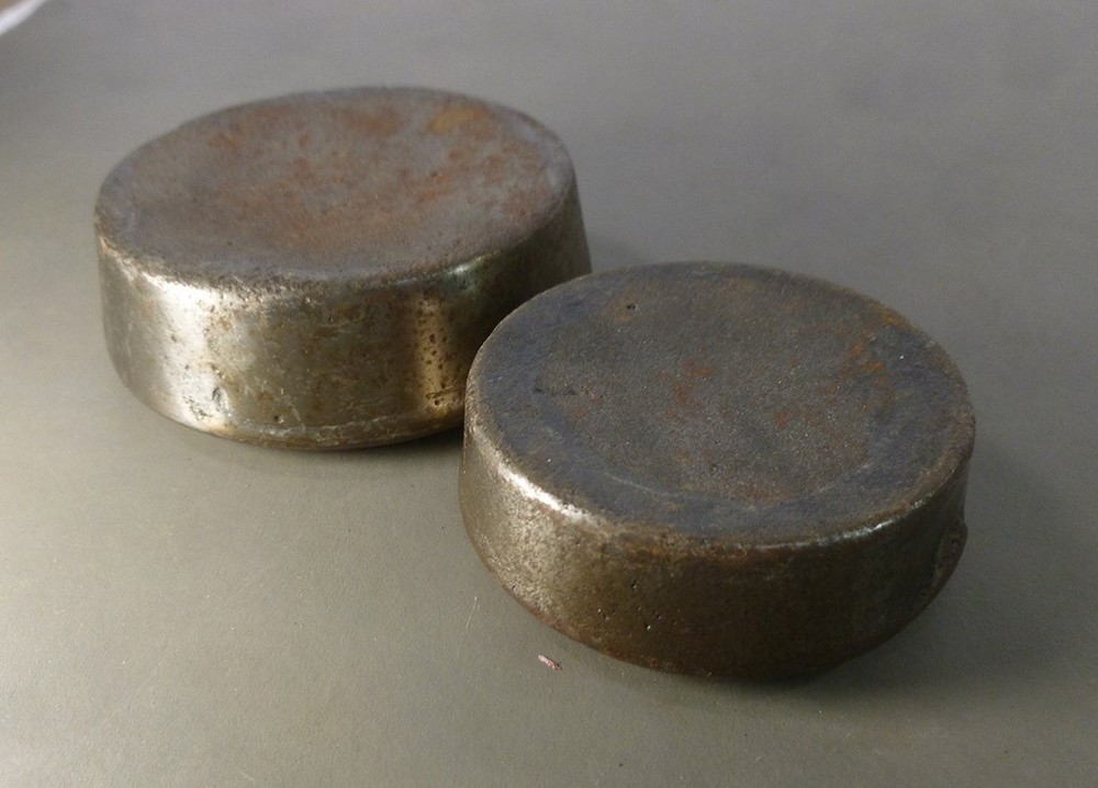 TWO cast iron WEIGHTS trade type SCALE ACCESSORY 1 lb and 8 oz round stacking