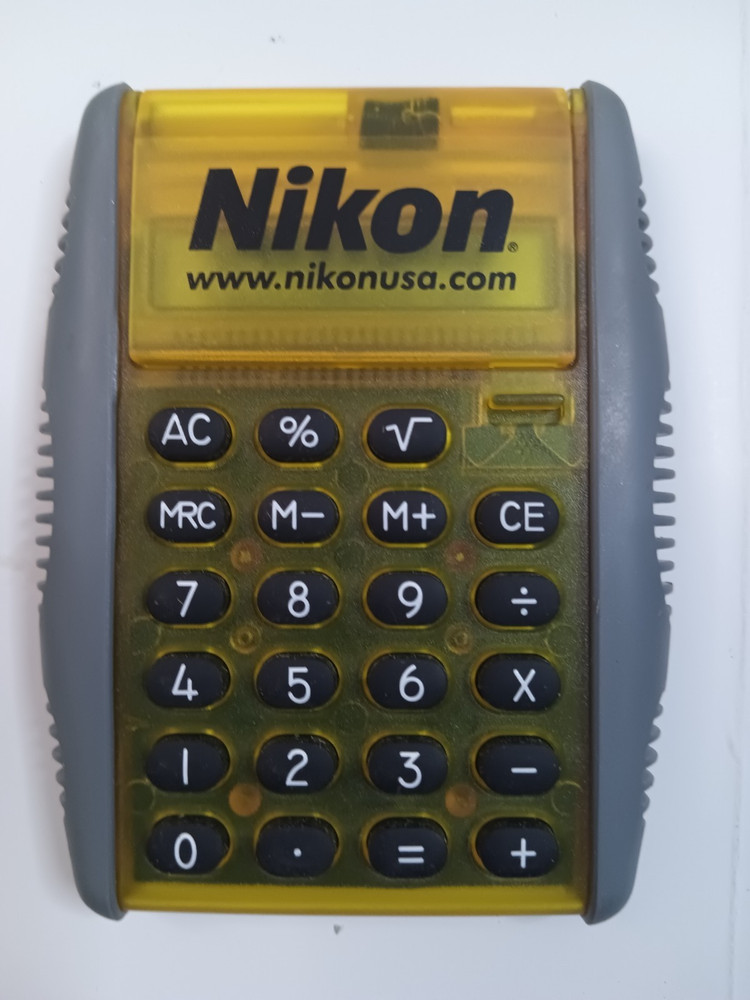 NIKON FOLDING CALCULATOR & NOTE PAD HANDHELD