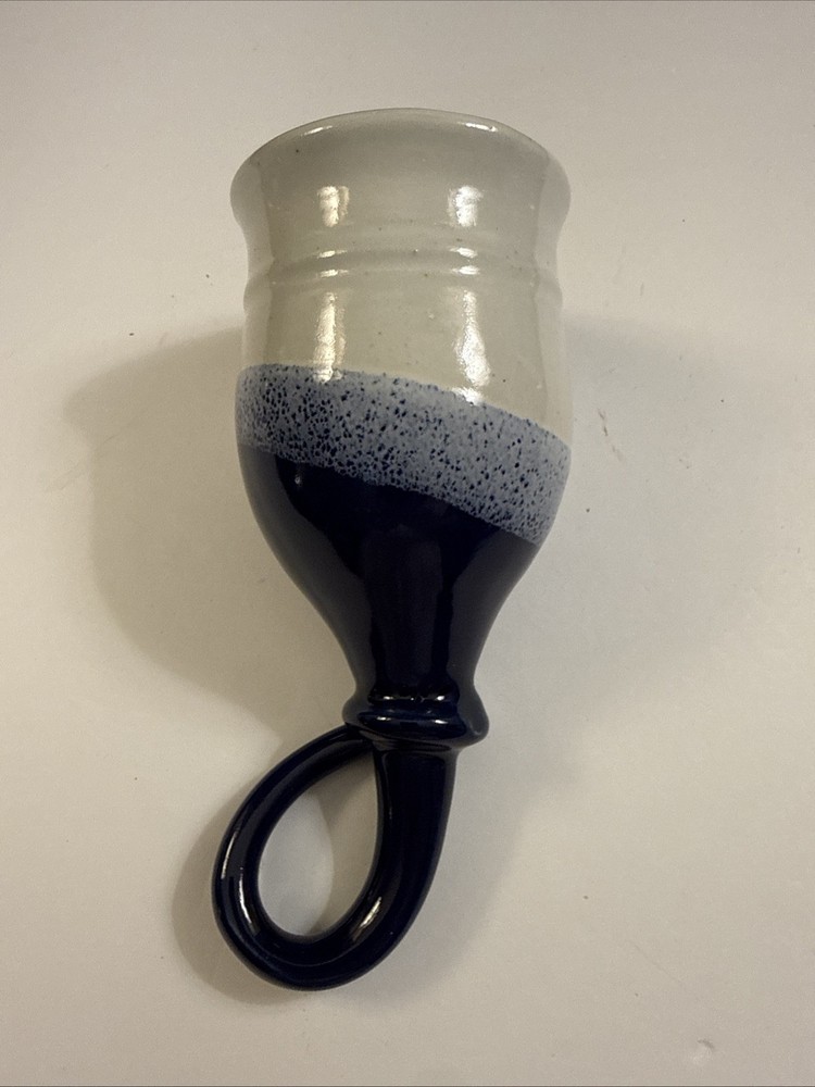 Handmade studio pottery drinking horn with a looped handle.