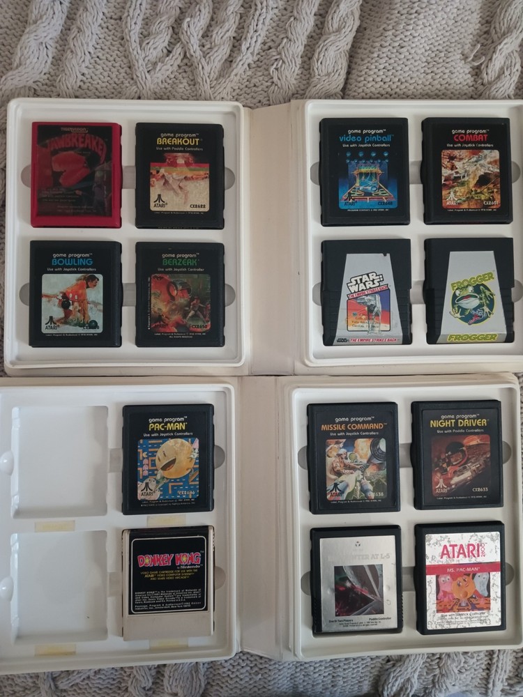 Vintage Atari 2600 Game lot with Atari Original storage cases, untested