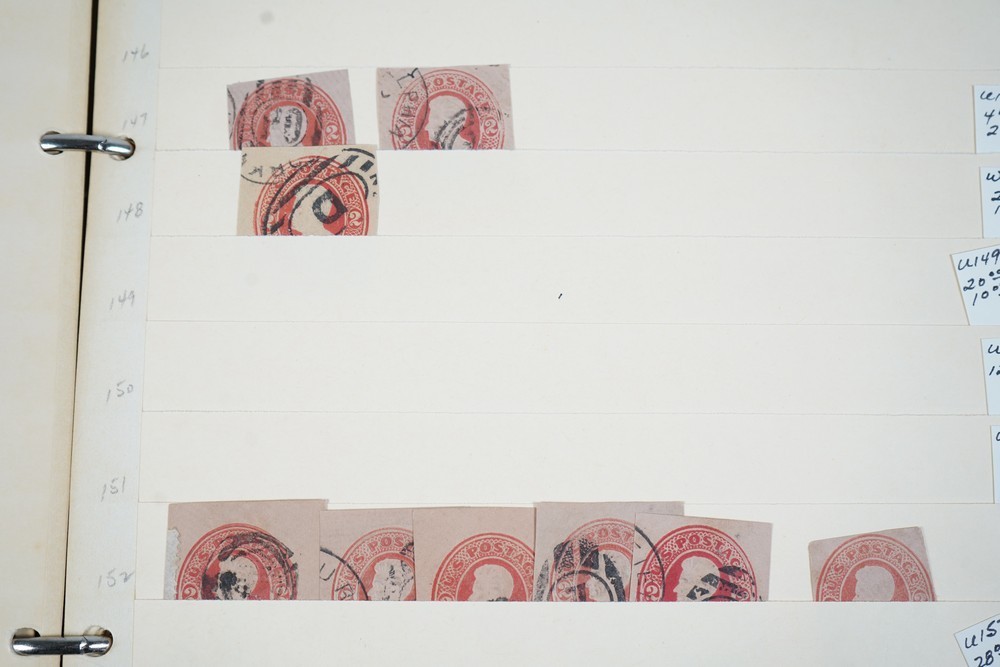 US COLLECTION OF 1,200+ STATIONERY CUT SQUARE STAMPS STORED IN STOCKBOOK