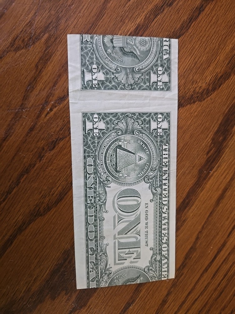Miscut one crisp dollar bill 1985.