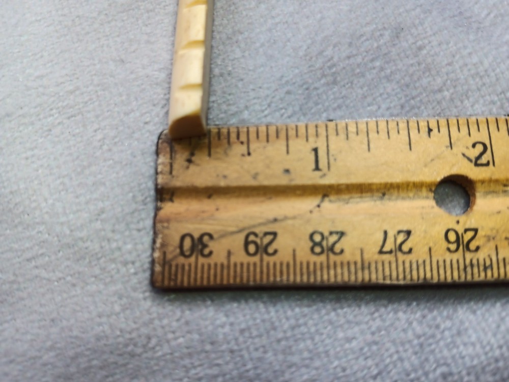 Vintage unbranded bone guitar nut, white