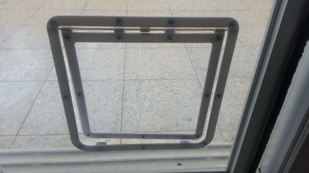 Cat door on mosquito net