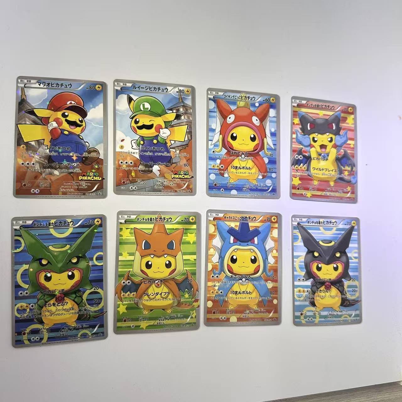 POKEMON PIKACHU PONCHO CHARIZARD MARIO LUIGI RAYQUAZA COMPLETE SET 8 Card