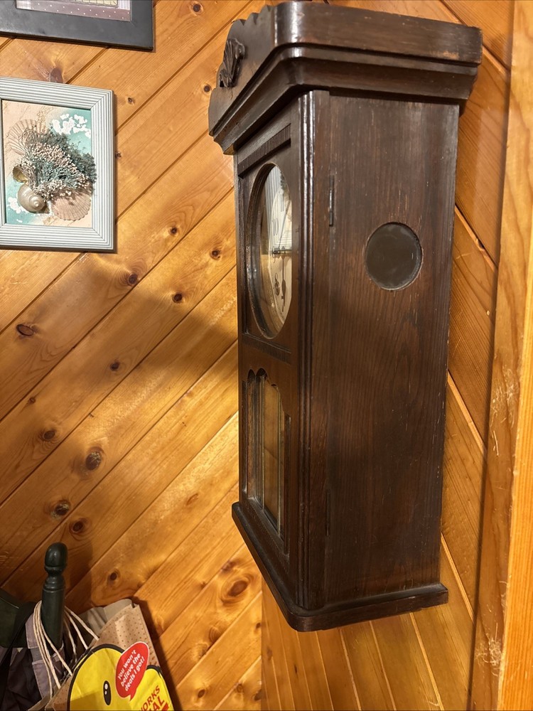 Vintage spring pendulum clock made by Meiji Clock Co.