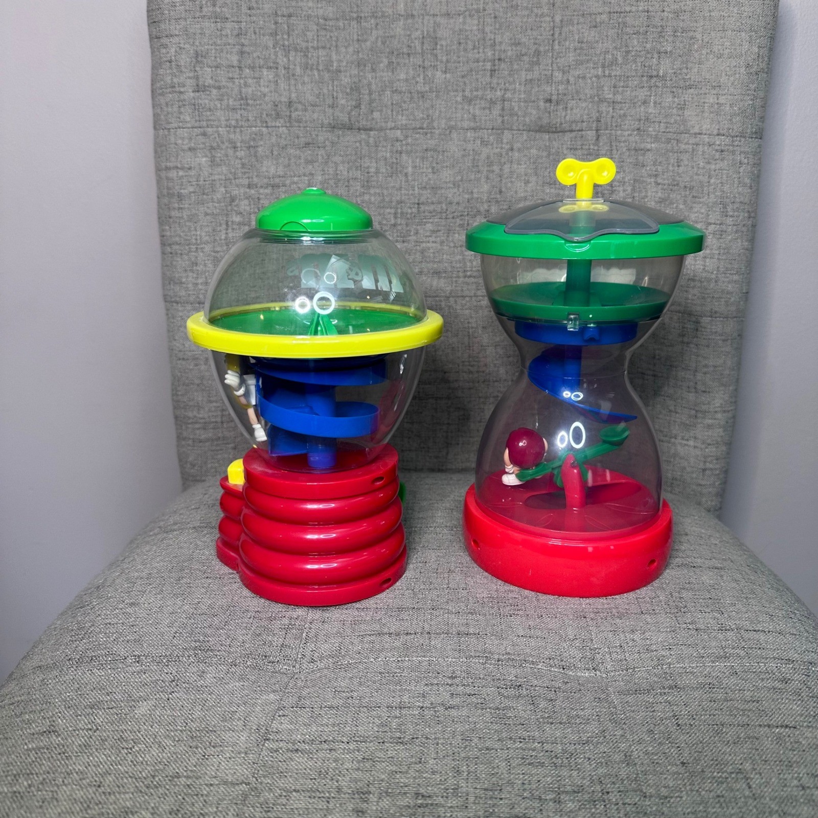 M M candy dispenser toy 2 piece lot spinning spiral chase fun