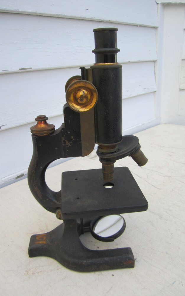 Antique microscope with brass trim