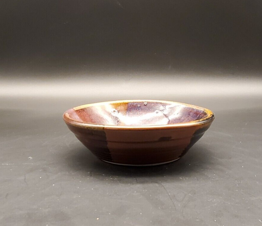 Art pottery bowl with geometric pattern signed