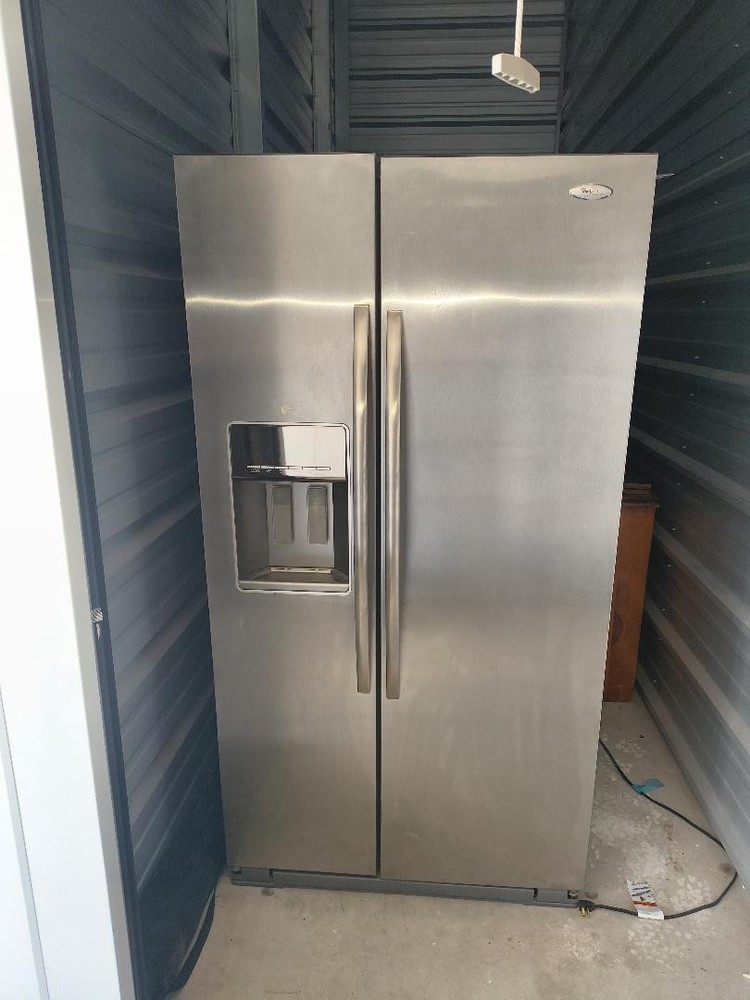 Whirlpool side by side refrigerator /freezer