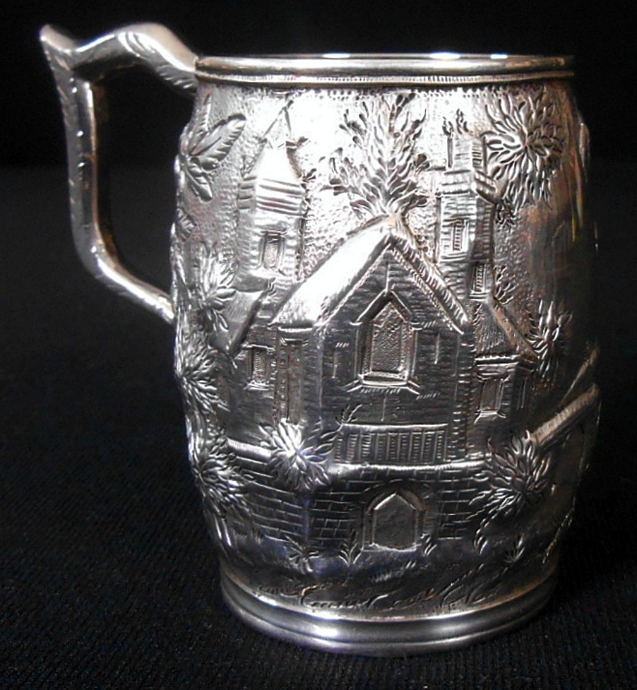 A solid silver child's mug, architectural repousse, S. Kirk & Son, 11 oz, c.1860