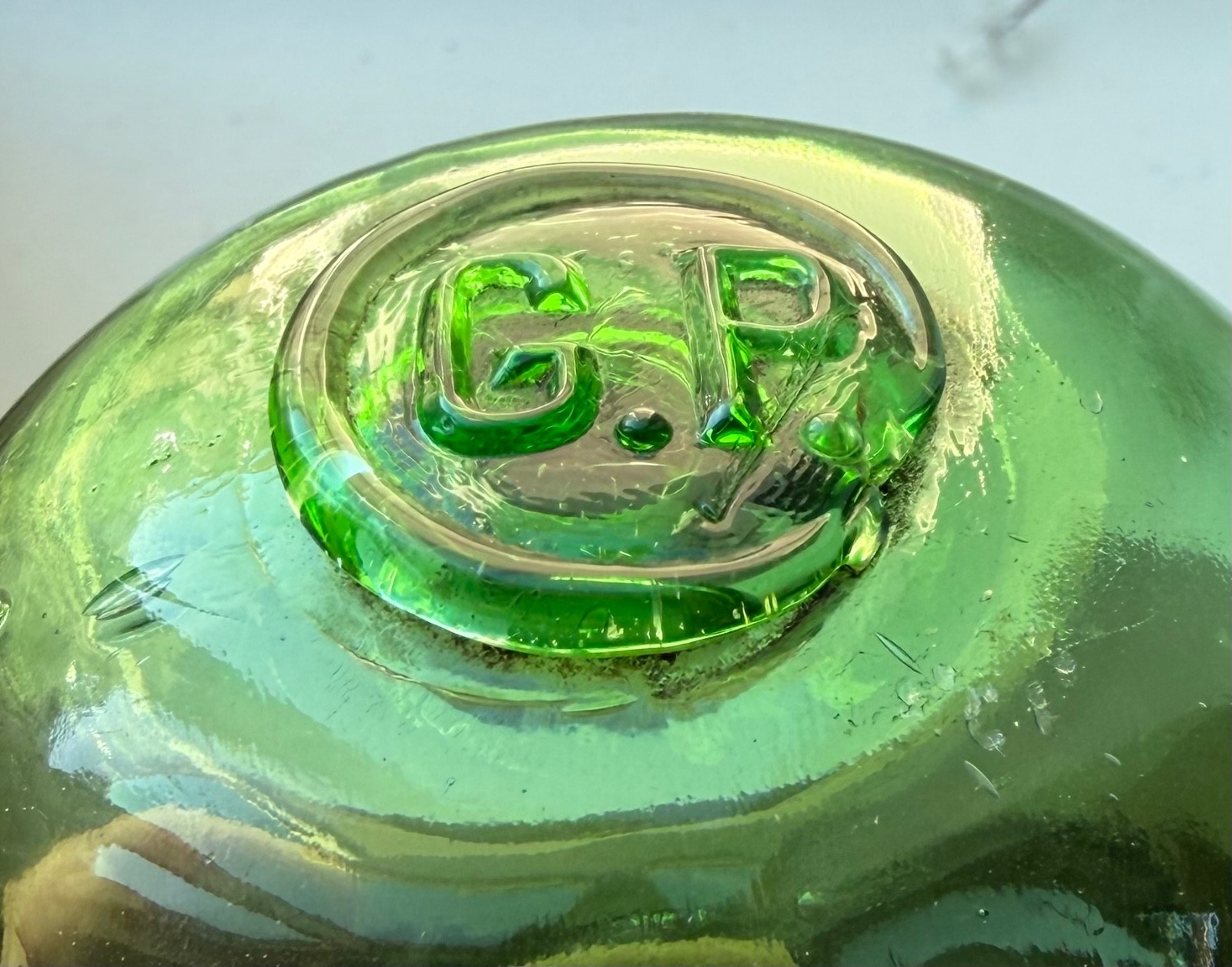 Glass fishing float marked G.P.