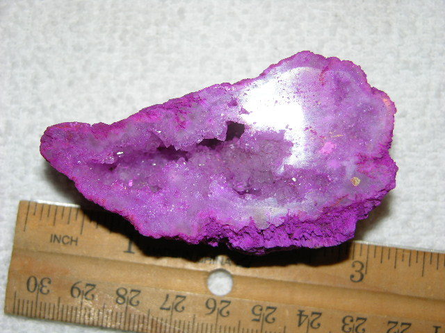 Geode cut & polished half with colored crystal center 3 inch E64