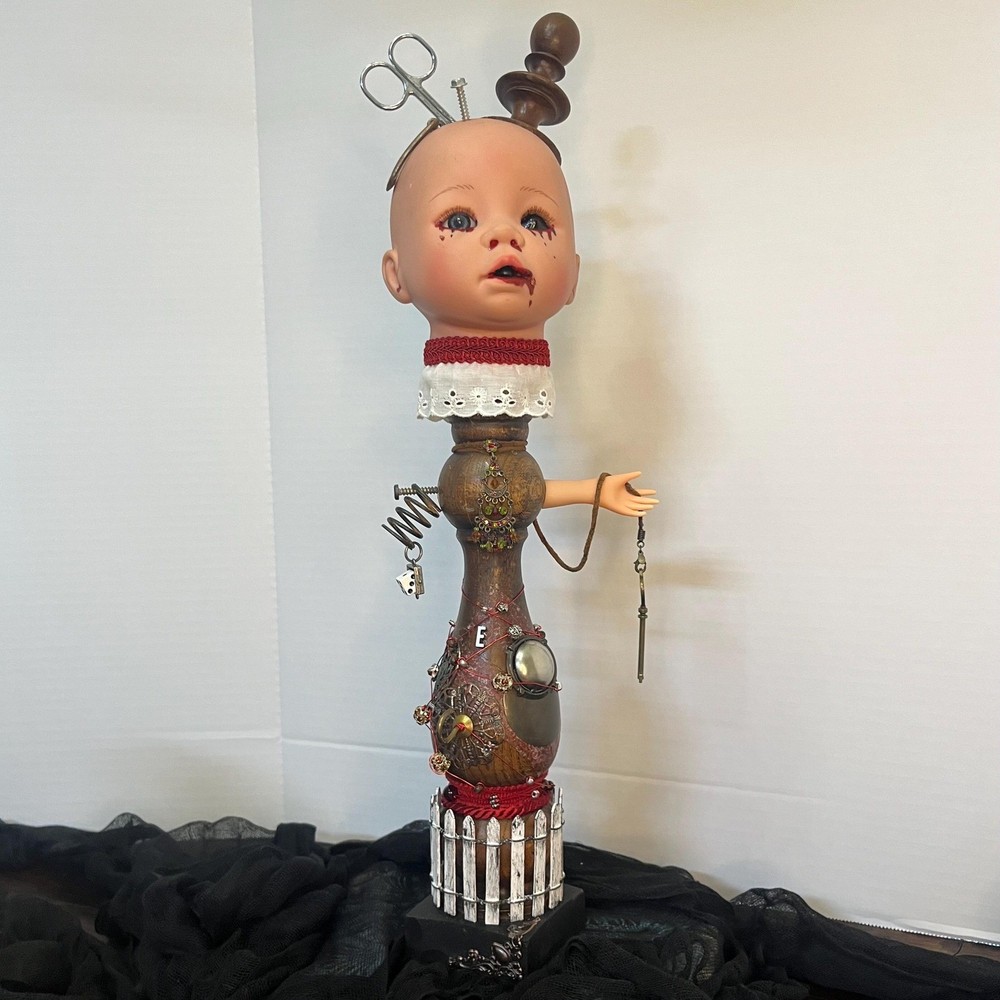 Creepy doll with scissors and key