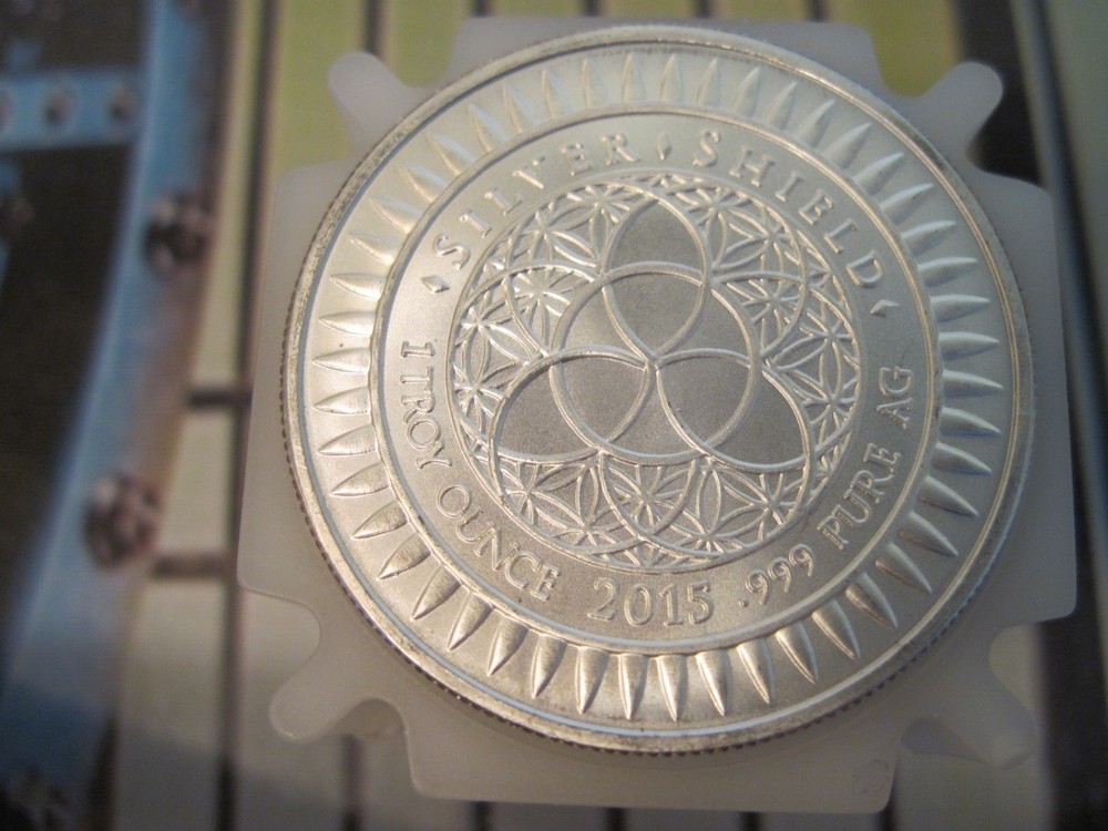 2015 1 OZ MERRY CONSUMERISM BU SILVER SHIELD