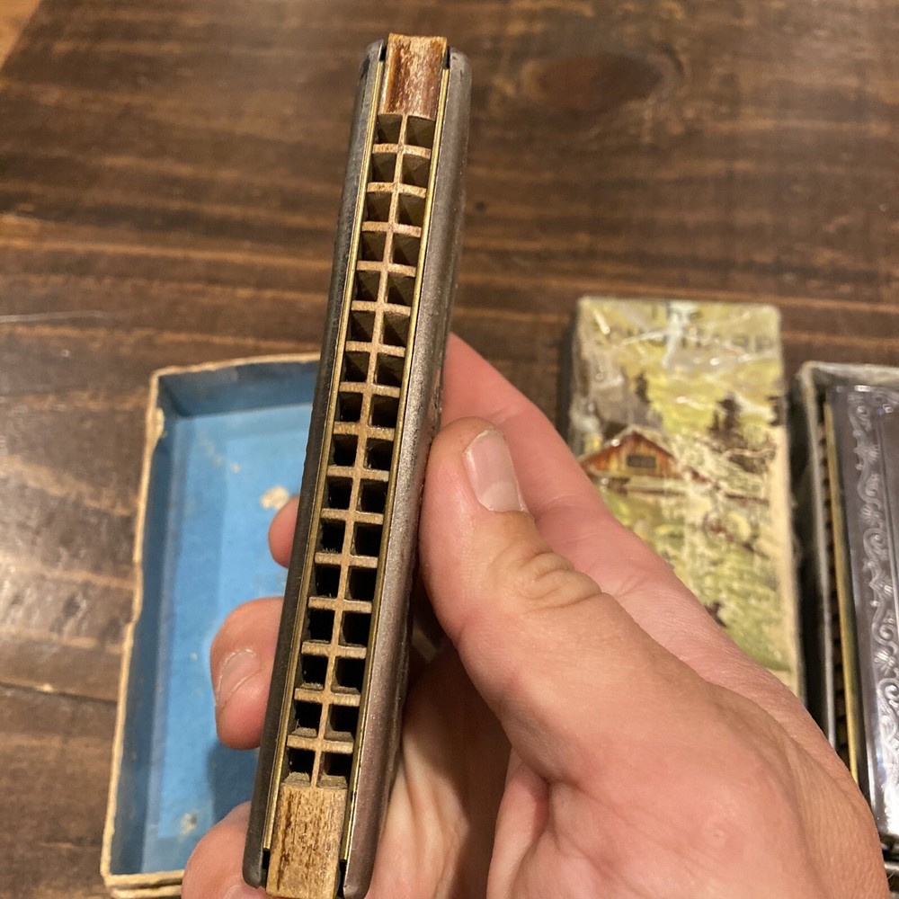 two M Hohner Echo harmonicas with rough boxes dofferent styles