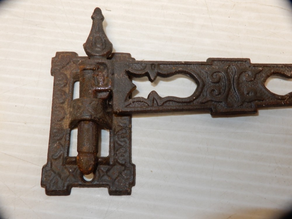 ANTIQUE CAST IRON SWINGING WALL HOOK CA 1870