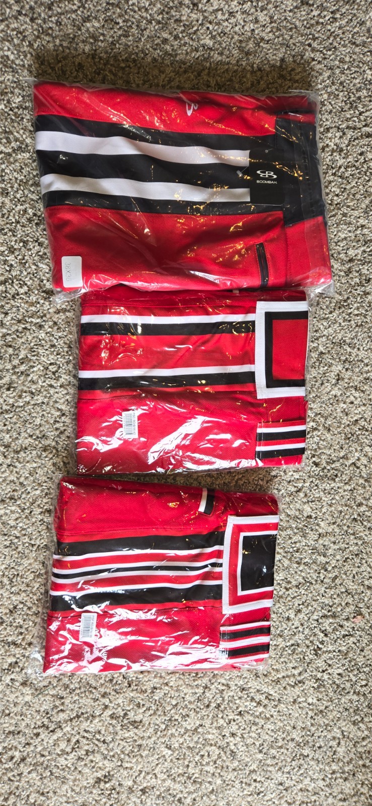 70 pairs Men's softball pants, White, Red, Black. Most new.