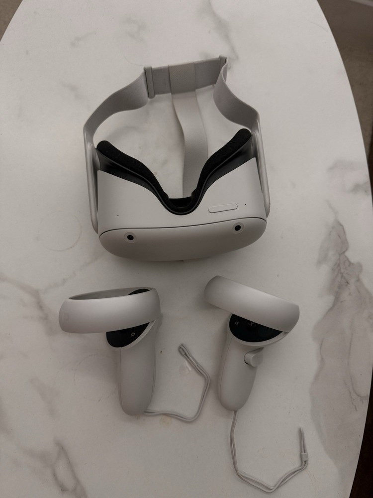 Meta Quest 2 All-In-One VR Headset with its controllers