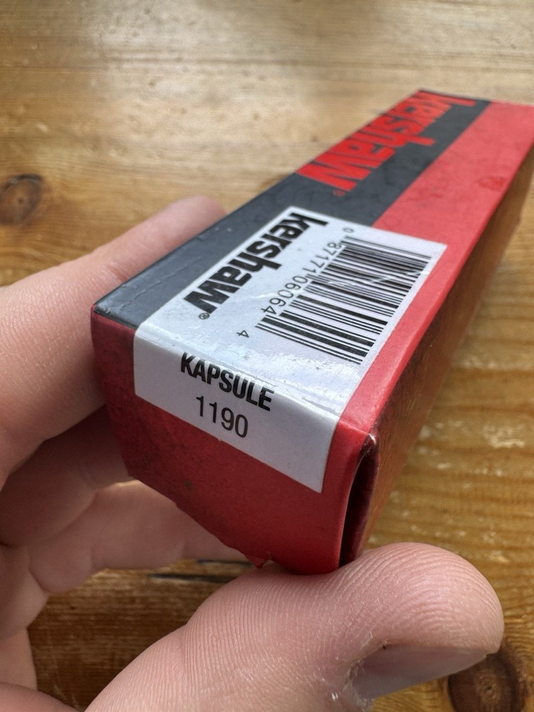 Kershaw Kapsule Manual Open Sliding Button Lock Single Edge Spear Point Blade