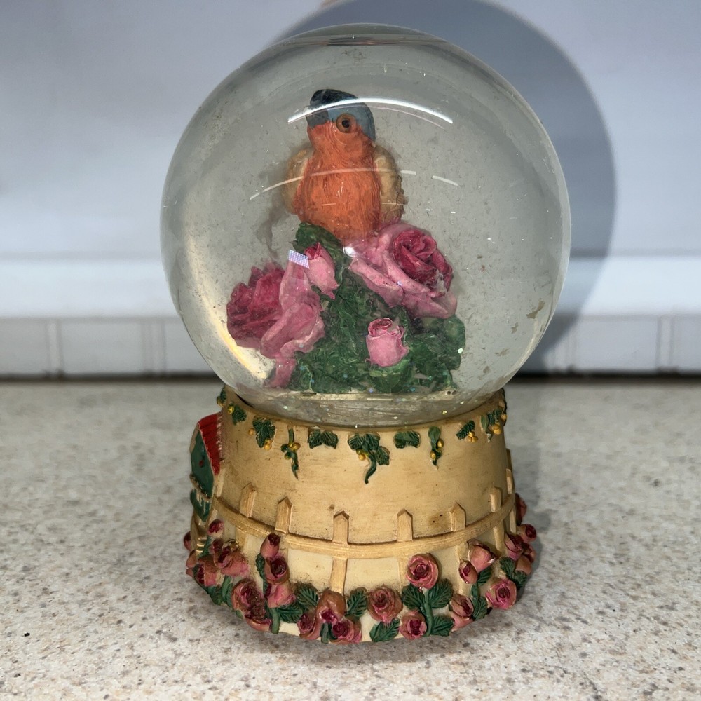 Vintage bird snow globe