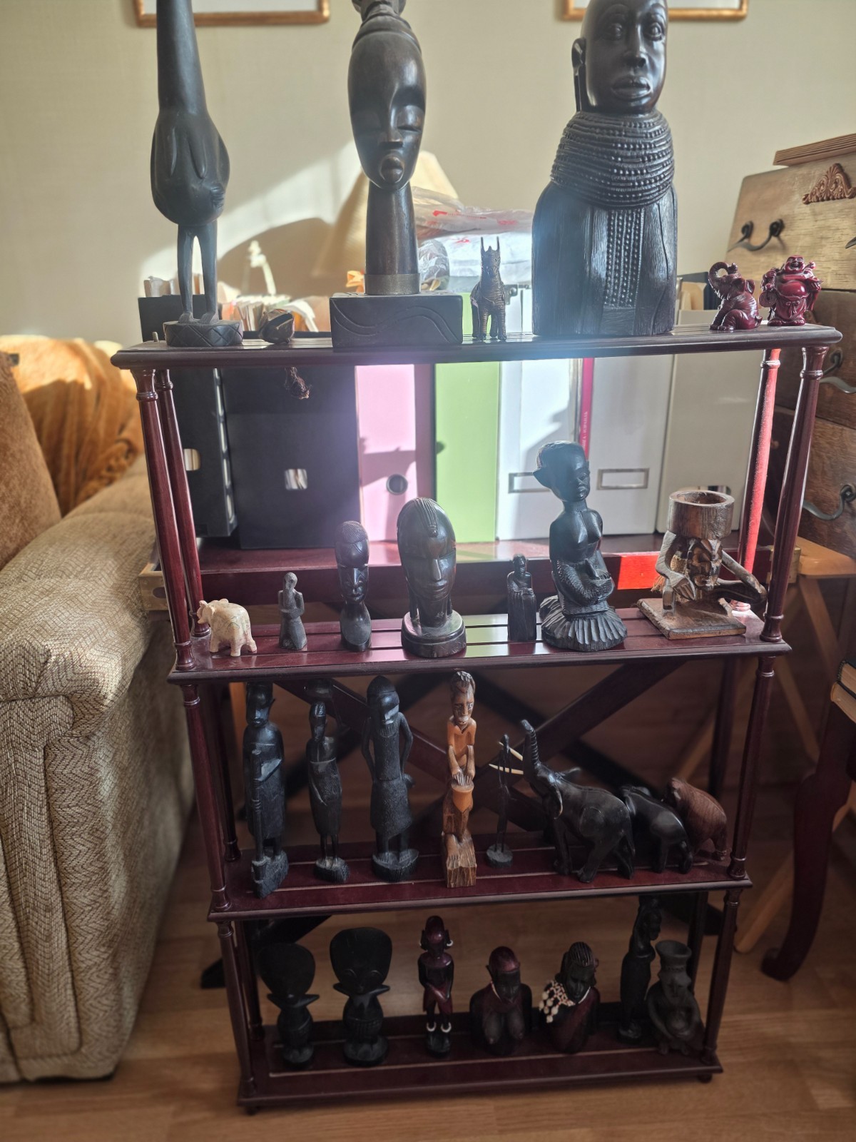 Set of carved statues from black wood, stone, bronze.