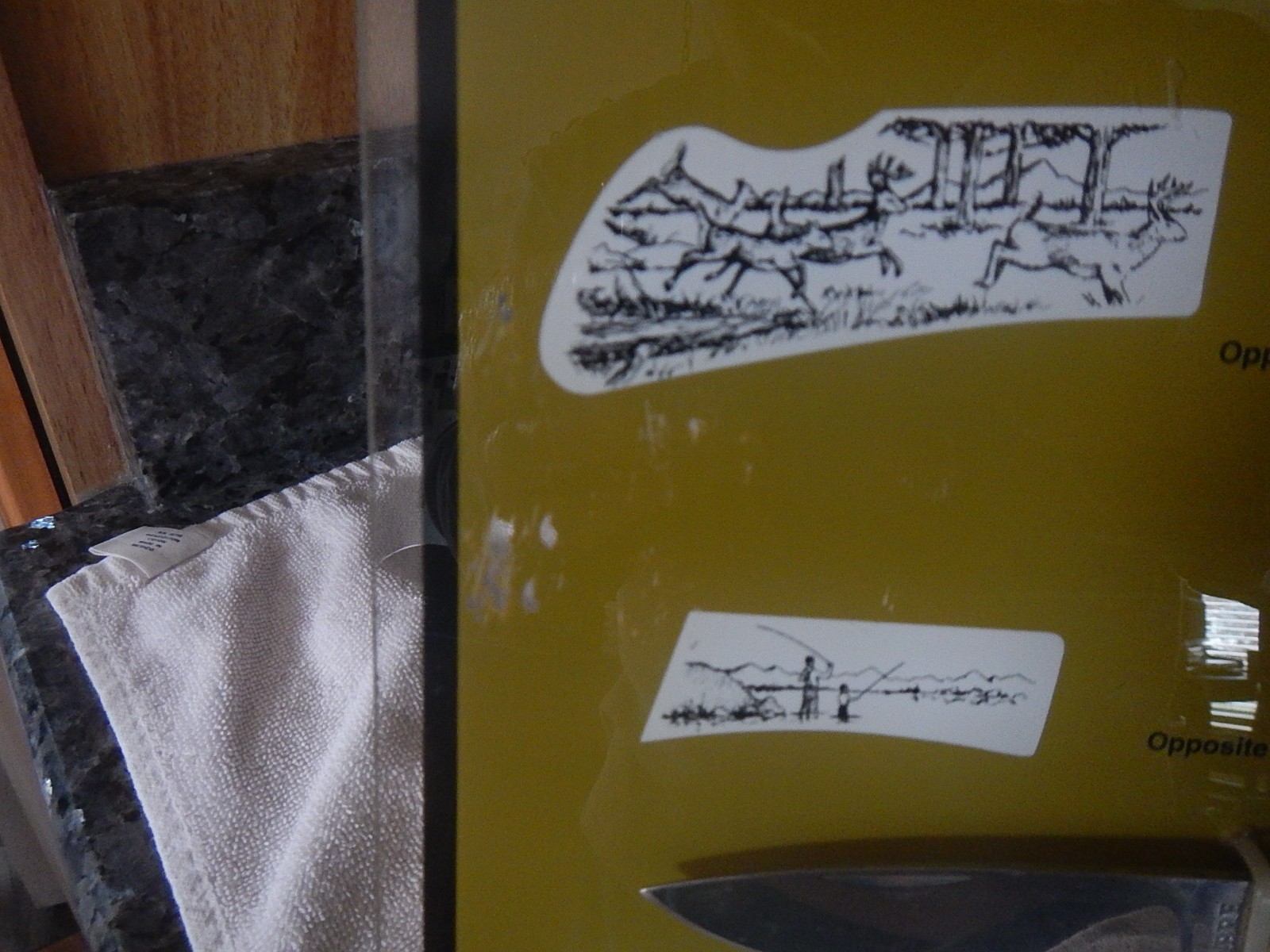 Vintage Sabre scrimshaw knife counter top store display with one NOS knife