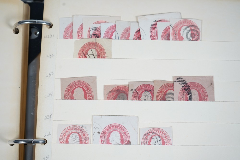 US COLLECTION OF 1,200+ STATIONERY CUT SQUARE STAMPS STORED IN STOCKBOOK