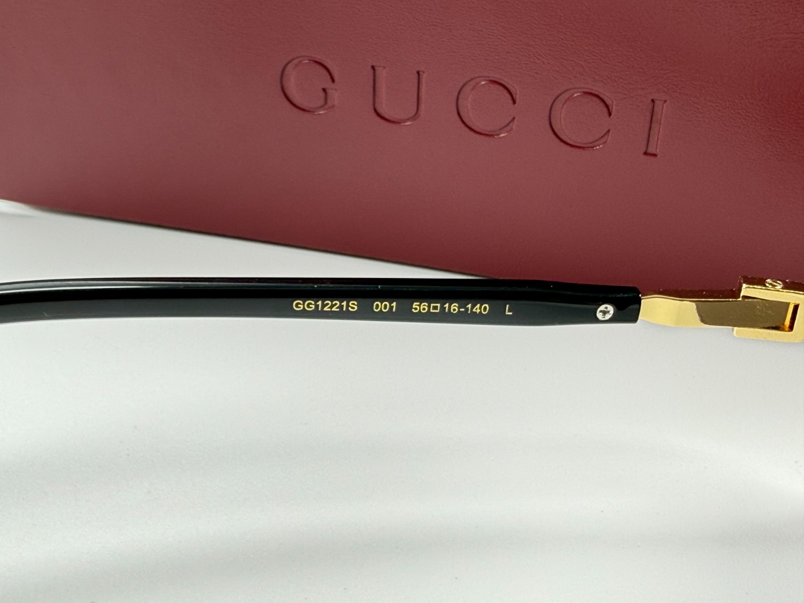 Gucci GG1221S 001 Black Gold Rimless Sunglasses Gray Lens 56mm