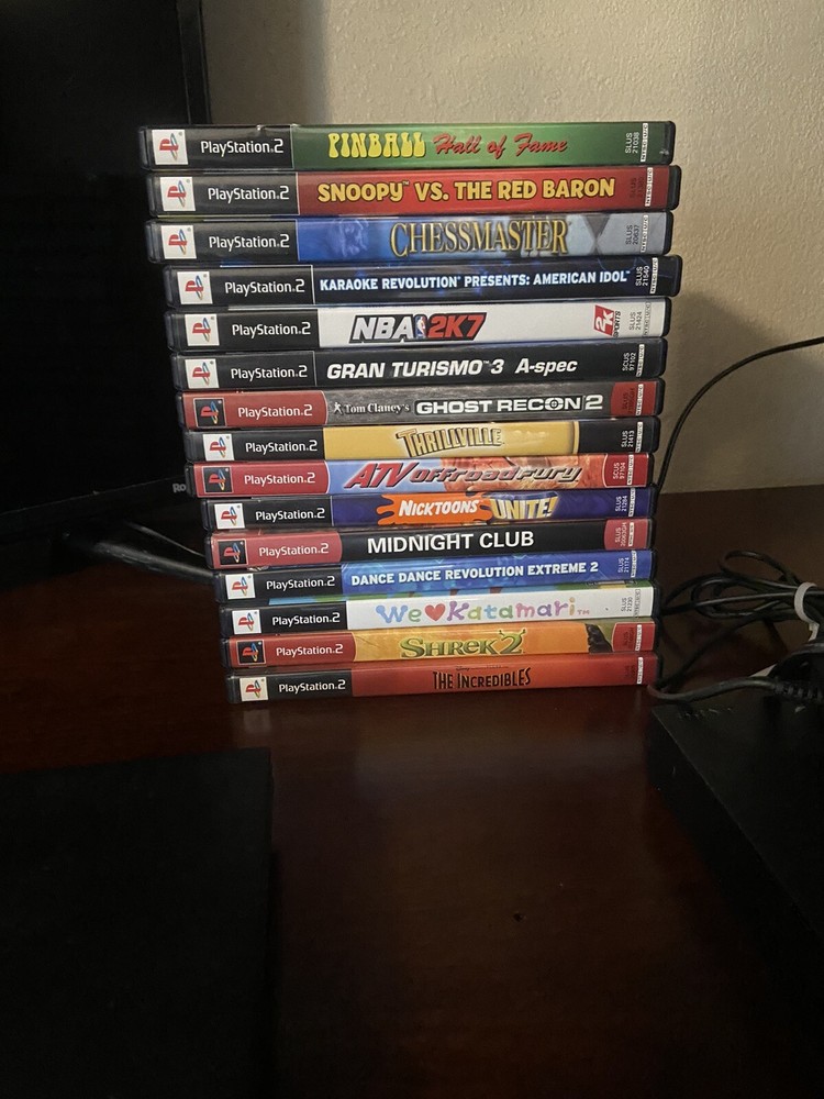 2 Ps2 Slims (one does Not Read Disc) + 4 Controllers + Memory Card+ 15 Games