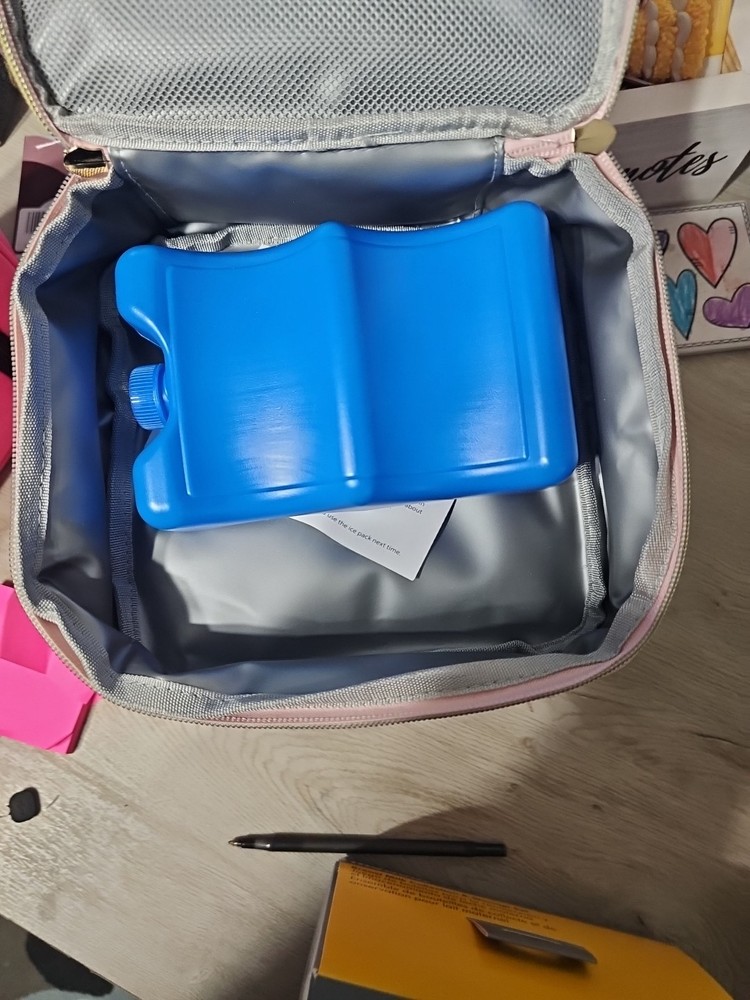 pink cooler and breast milk bottles.