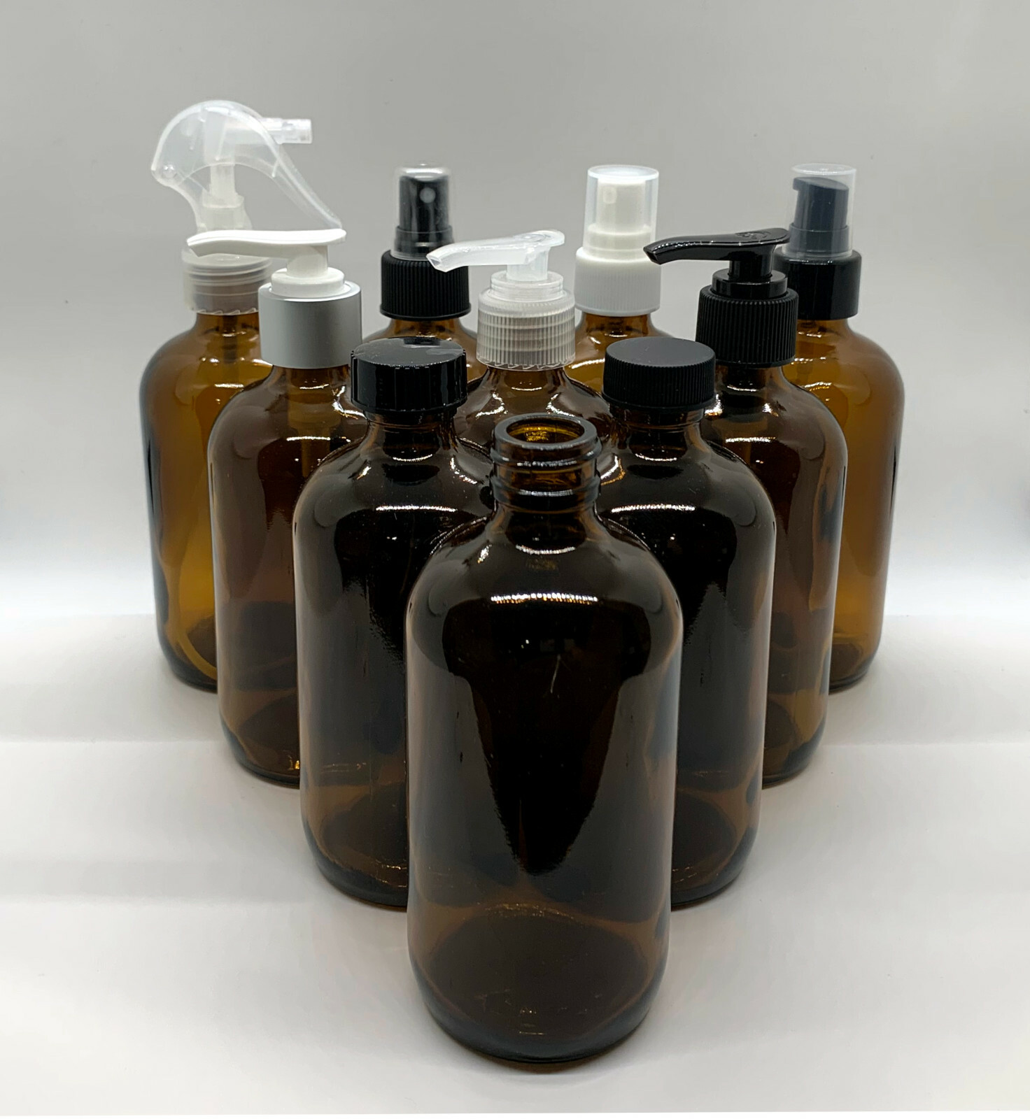 8 oz Amber Boston Round Glass Bottles with Caps and Pumps