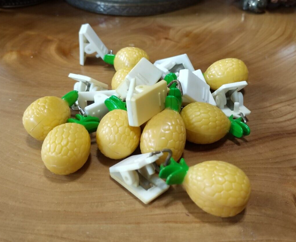 10 plastic pineapple shaped tablecloth weights. picnics, outdoor dining