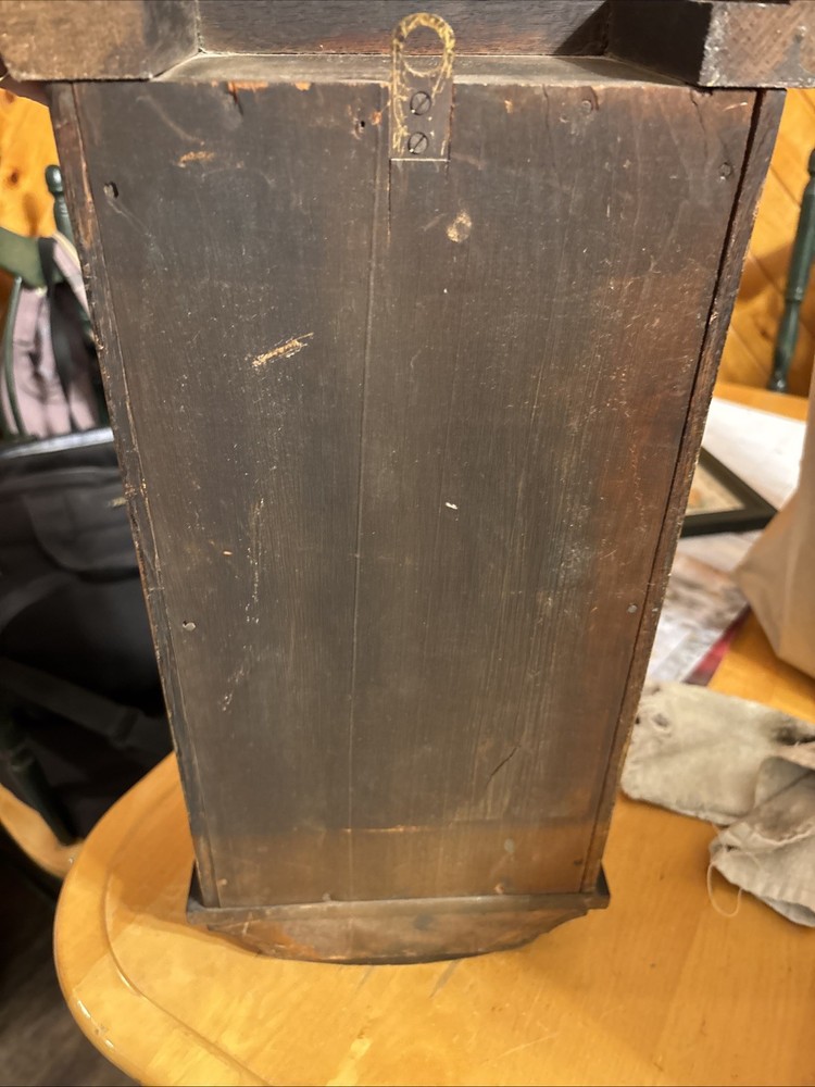 Vintage spring pendulum clock made by Meiji Clock Co.