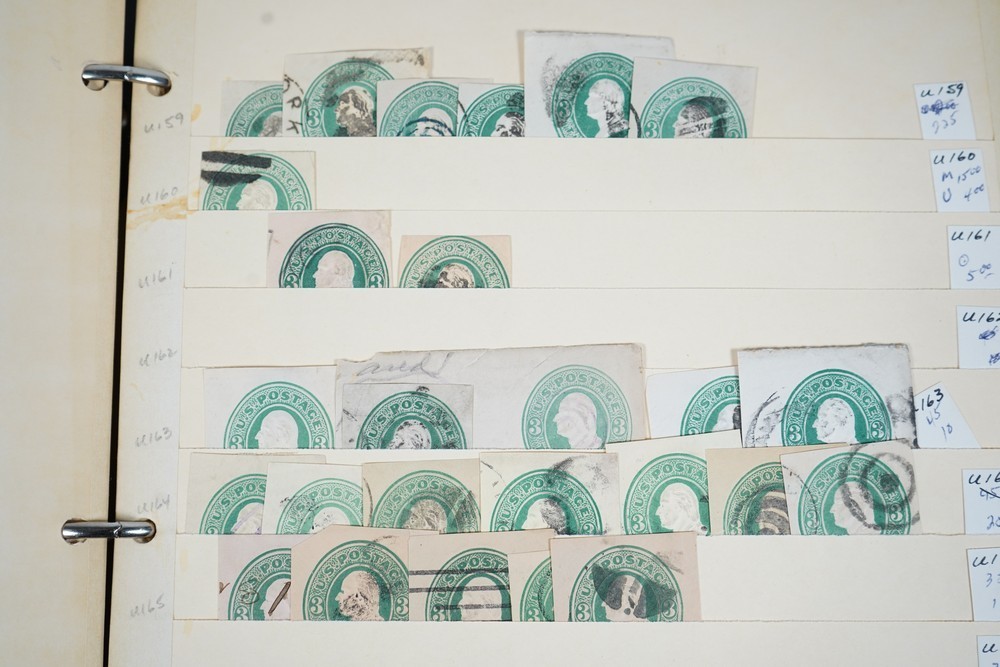 US COLLECTION OF 1,200+ STATIONERY CUT SQUARE STAMPS STORED IN STOCKBOOK