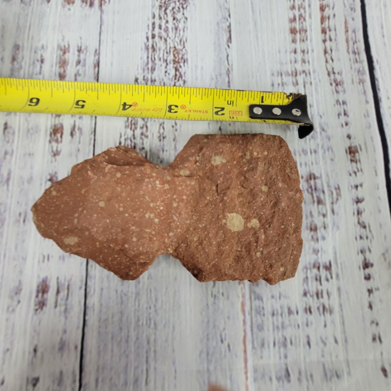 Vintage native American axe head 5 7/16" long 3" wide red and tans in color