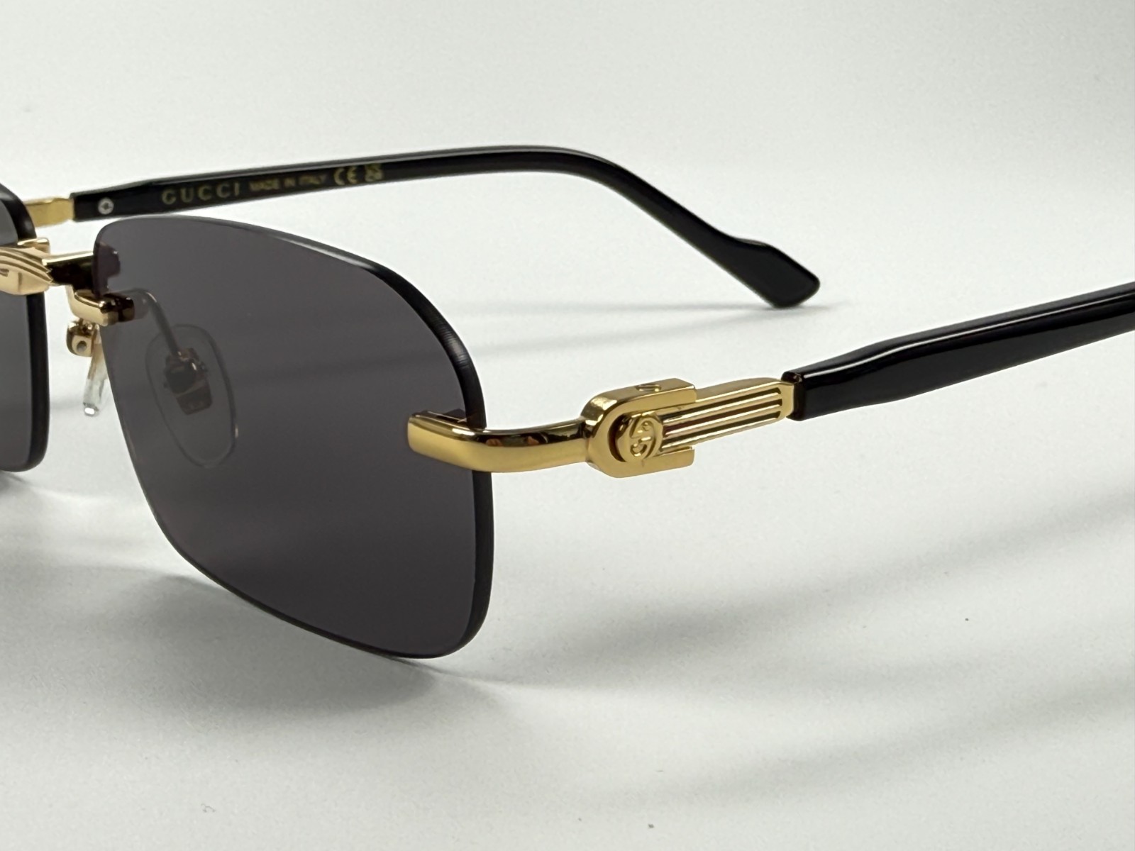 Gucci GG1221S 001 Black Gold Rimless Sunglasses Gray Lens 56mm